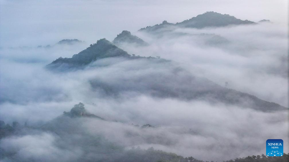 Scenery of Great Wall shrouded in clouds in Hebei