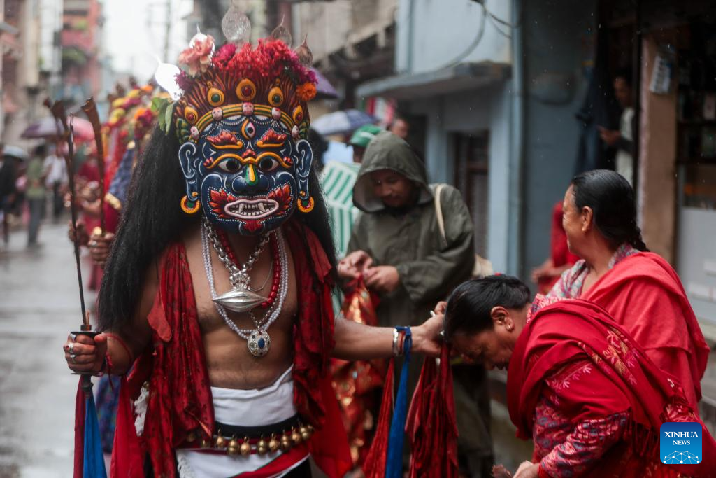 Masked dancers take part in parade in Kathmandu, Nepal