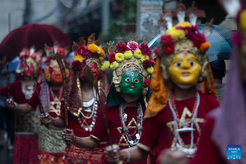 Masked dancers take part in parade in Kathmandu, Nepal