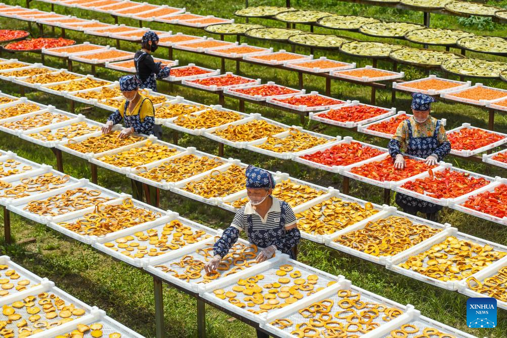 Villagers dry agricultural products in county of Yichun, E China