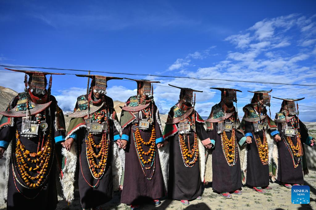 Villagers display folk costume in Pulan County, SW China's Xizang