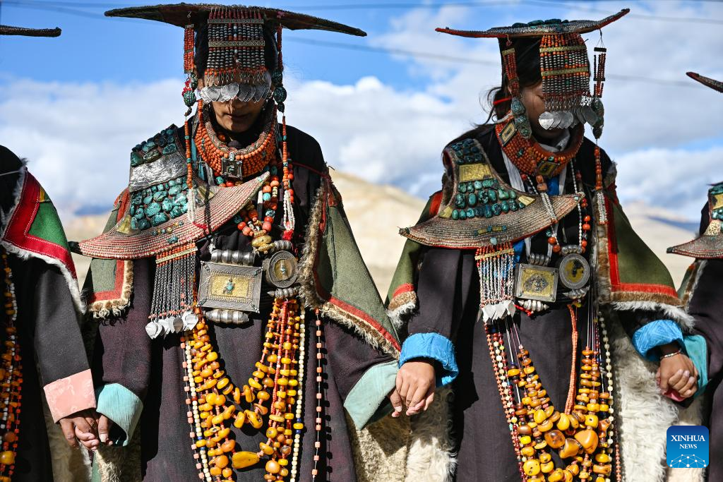 Villagers display folk costume in Pulan County, SW China's Xizang