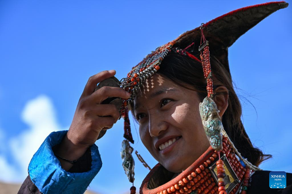 Villagers display folk costume in Pulan County, SW China's Xizang