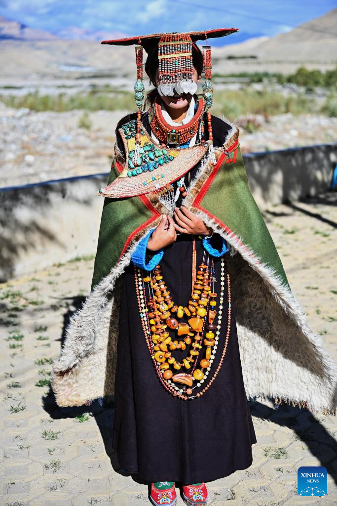 Villagers display folk costume in Pulan County, SW China's Xizang