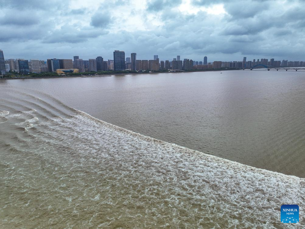 In pics: waves caused by the Qiantang River tidal bore in Hangzhou