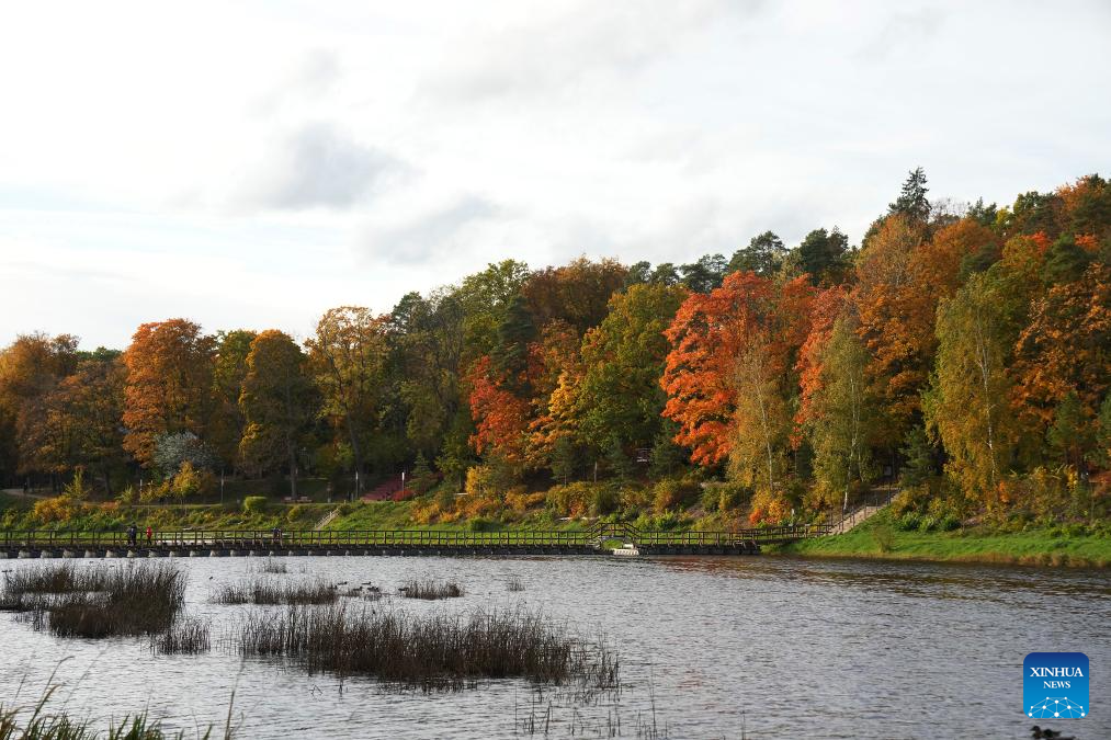 People enjoy autumn scenery in Ogre, Latvia