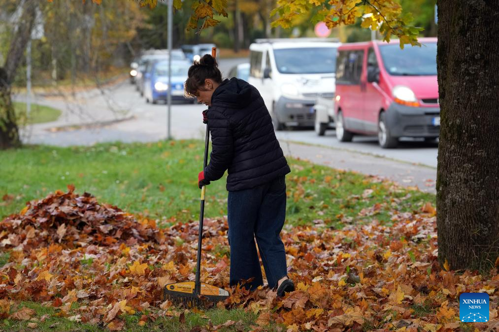 People enjoy autumn scenery in Ogre, Latvia