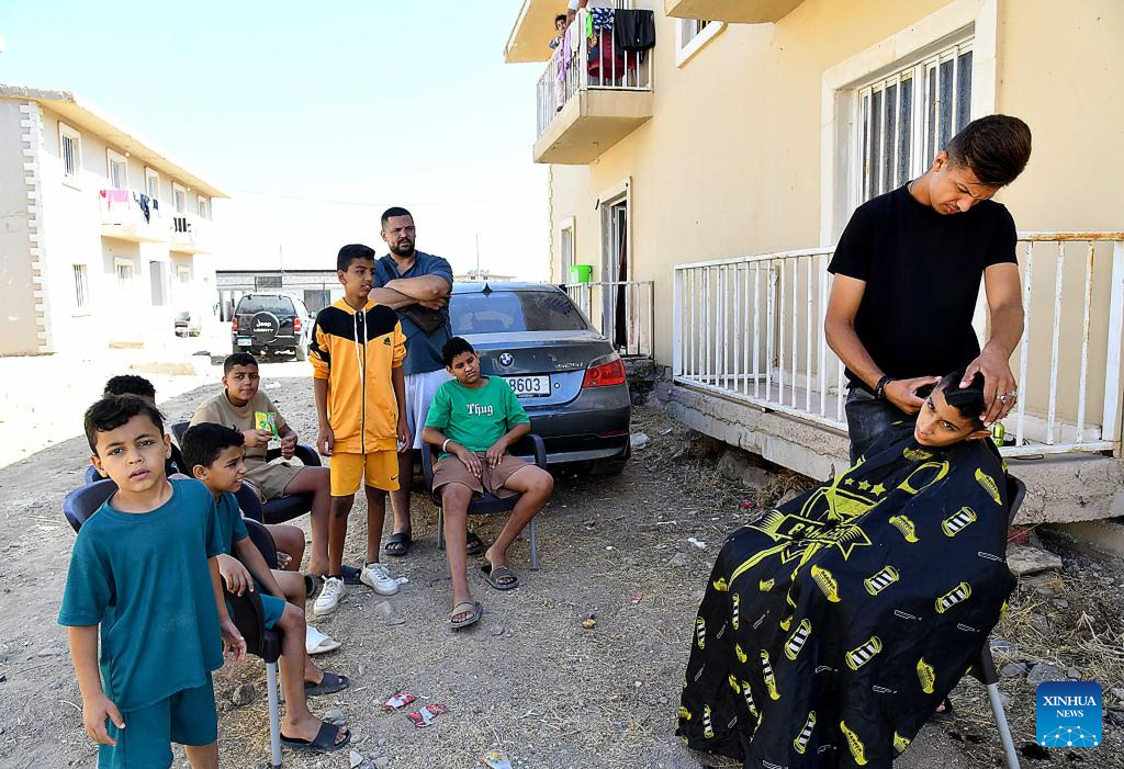 People fleeing from Lebanon seen at Harjalleh shelter center in Syria