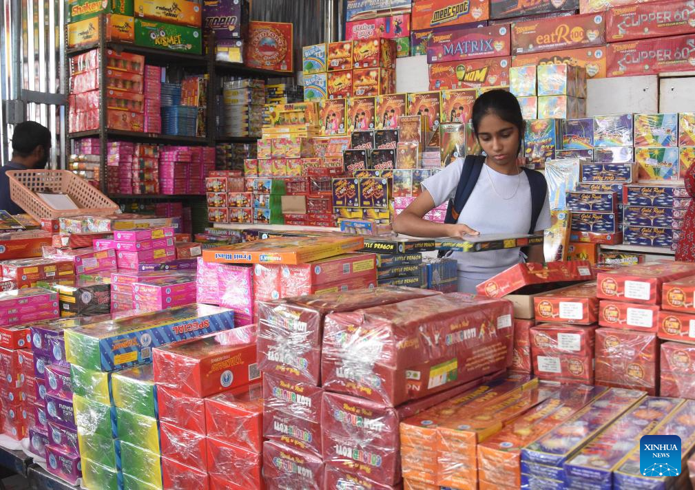 People shop before Diwali Festival in India