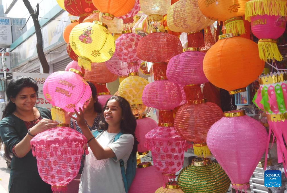 People shop before Diwali Festival in India