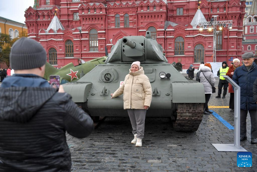 People visit outdoor exhibition commemorating military parade in 1941 in Moscow