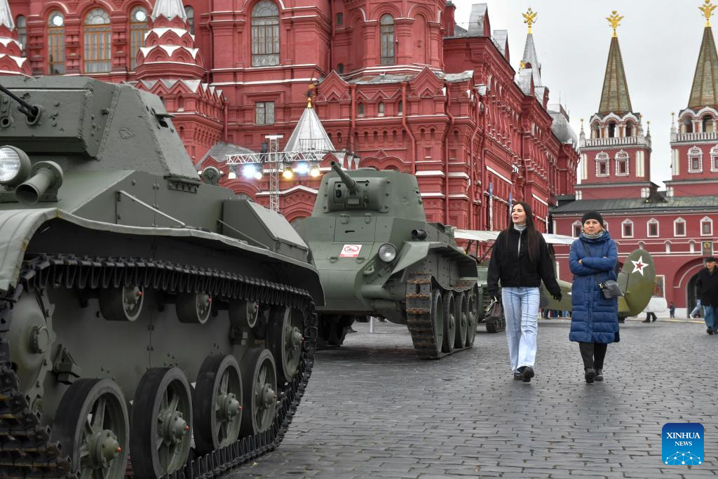 People visit outdoor exhibition commemorating military parade in 1941 in Moscow