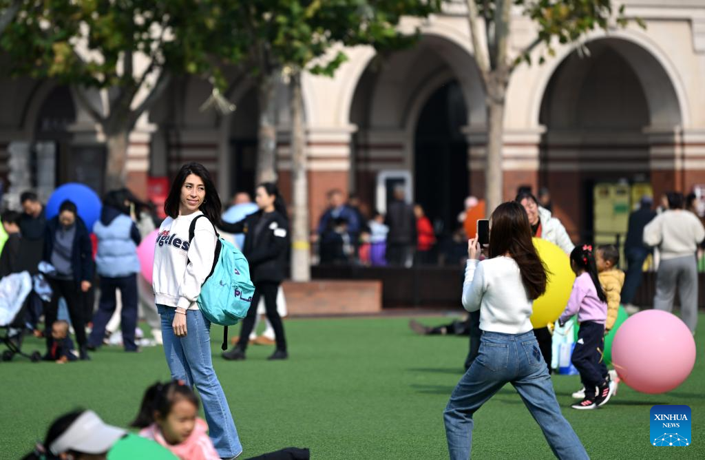 People enjoy leisure time at Minyuan Square in China's Tianjin