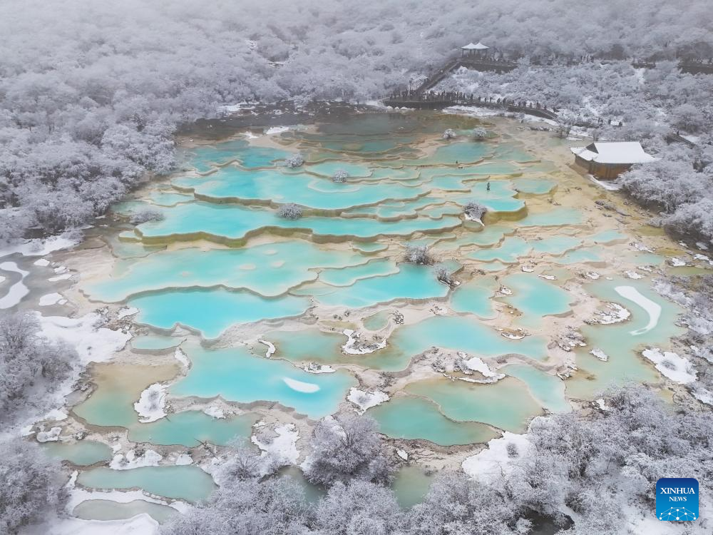 Scenery of colorful pond cluster at Huanglong scenic area in China's Sichuan