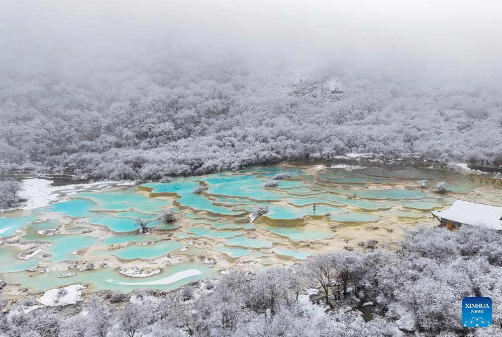 Scenery of colorful pond cluster at Huanglong scenic area in China's Sichuan