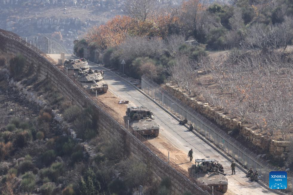 Israeli army controls border areas, strikes strategic weapons in Syria