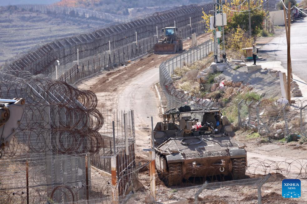 Israeli army controls border areas, strikes strategic weapons in Syria