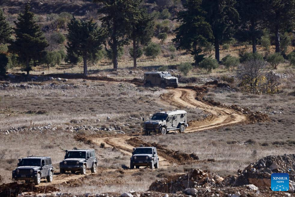 Israeli army controls border areas, strikes strategic weapons in Syria