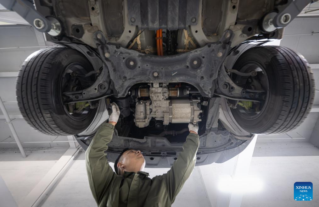 Pic story of NEV car mechanic in Wuhan, China's Hubei