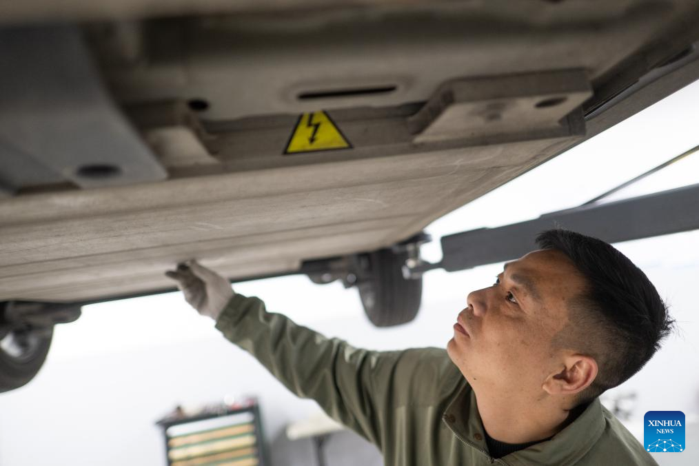 Pic story of NEV car mechanic in Wuhan, China's Hubei