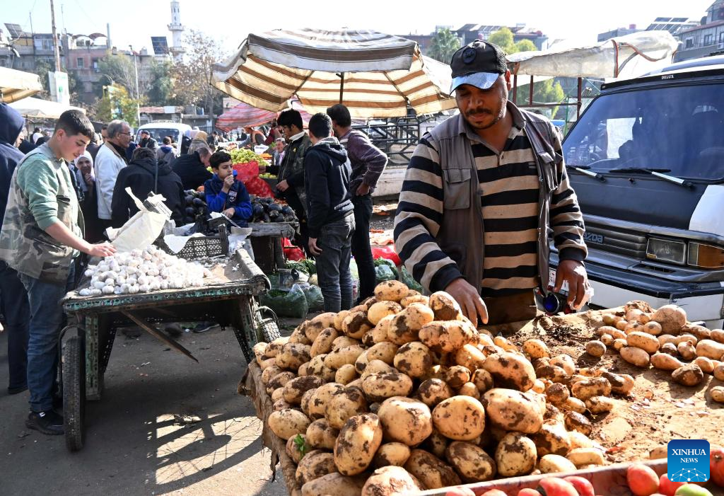 Vendors display goods for sale in Damascus, Syria