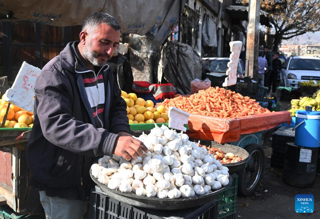 Vendors display goods for sale in Damascus, Syria