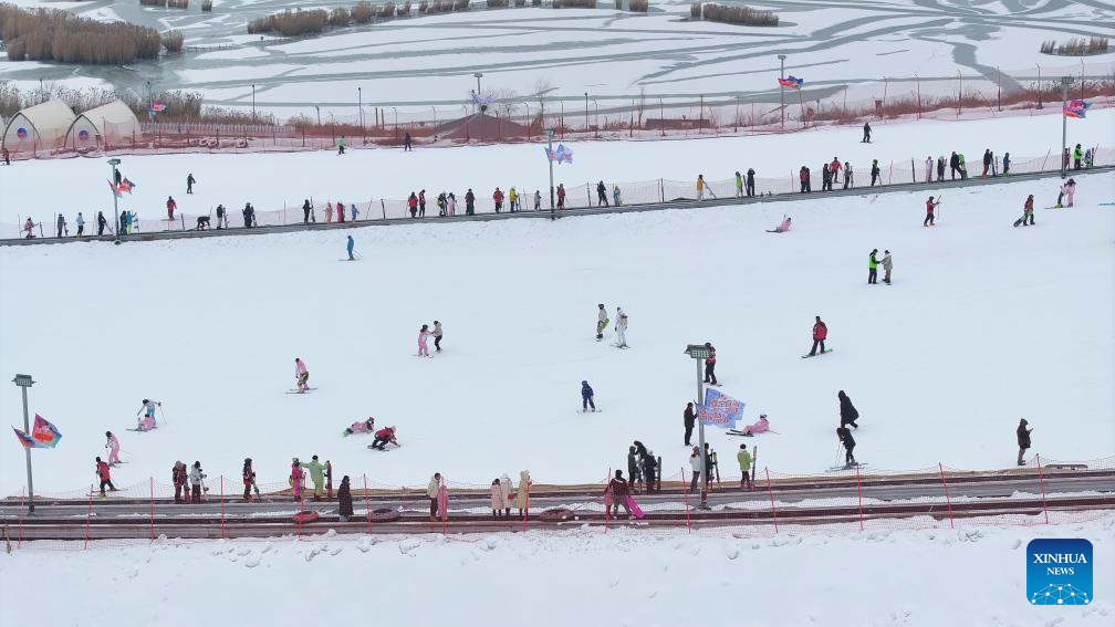 Tourists ski at Yuehai Ski Resort in Yinchuan, China's Ningxia