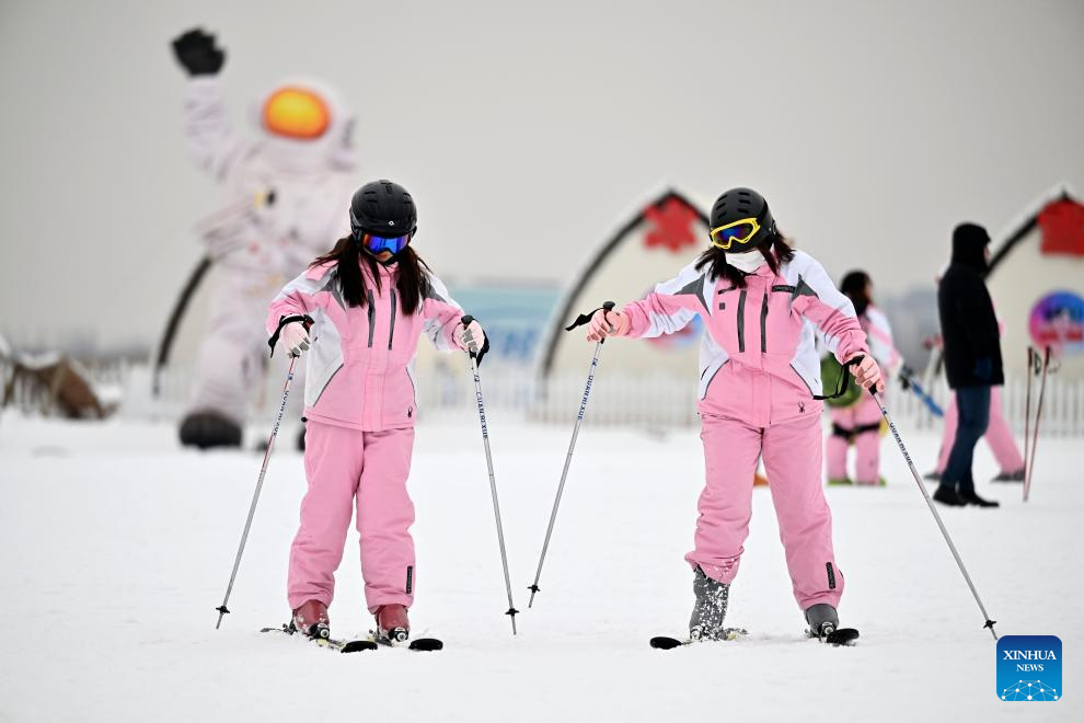 Tourists ski at Yuehai Ski Resort in Yinchuan, China's Ningxia