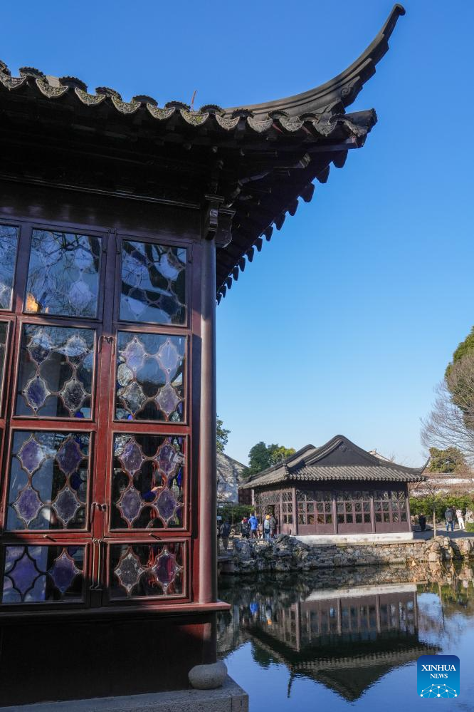 Tourists visit Humble Administrator's Garden in Suzhou, E China