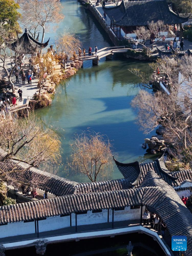 Tourists visit Humble Administrator's Garden in Suzhou, E China