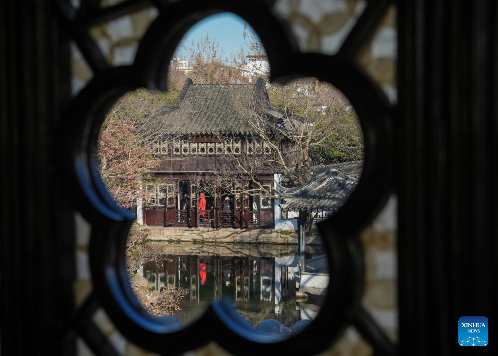 Tourists visit Humble Administrator's Garden in Suzhou, E China