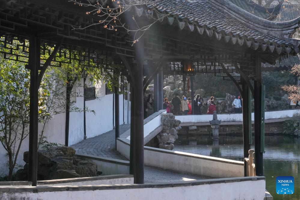 Tourists visit Humble Administrator's Garden in Suzhou, E China