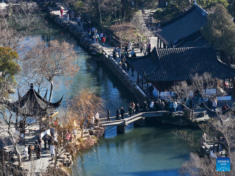 Tourists visit Humble Administrator's Garden in Suzhou, E China