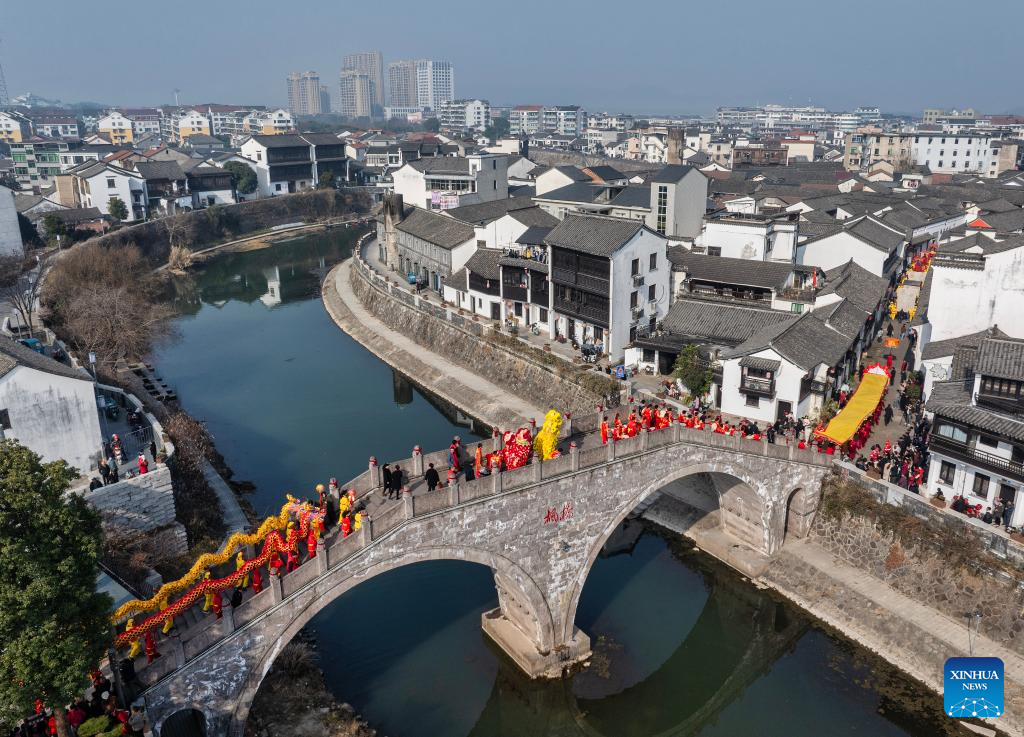 People immerse themselves in traditional customs and partake in festivities before Spring Festival across China