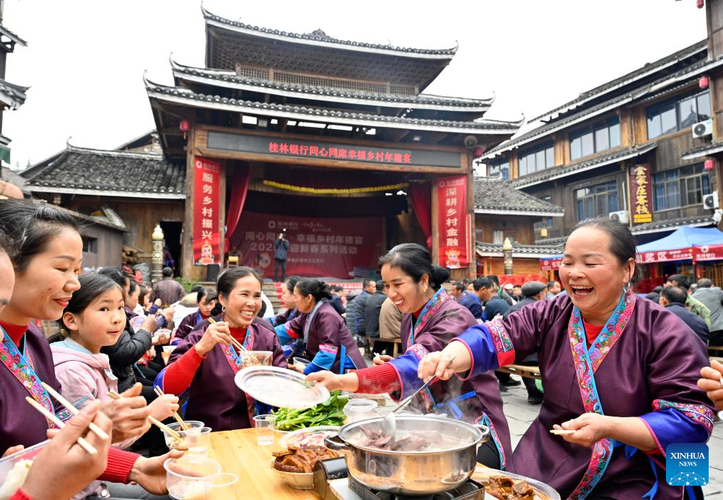 People immerse themselves in traditional customs and partake in festivities before Spring Festival across China