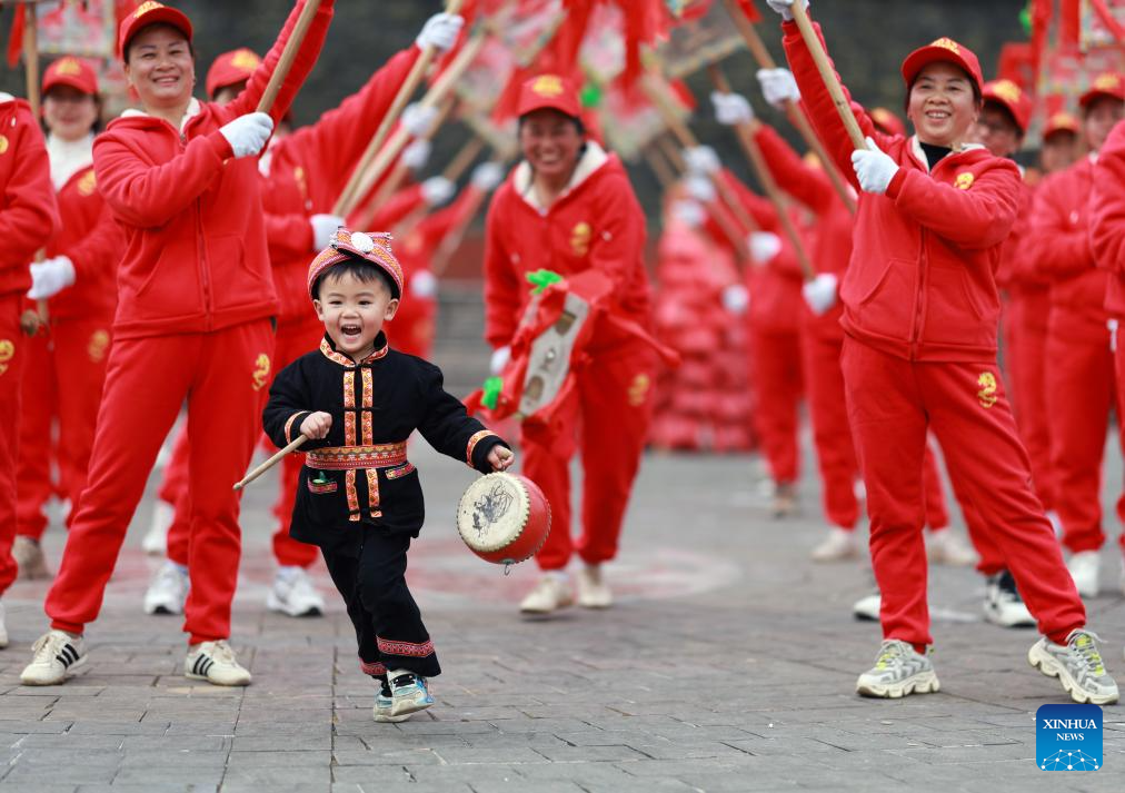 People immerse themselves in traditional customs and partake in festivities before Spring Festival across China