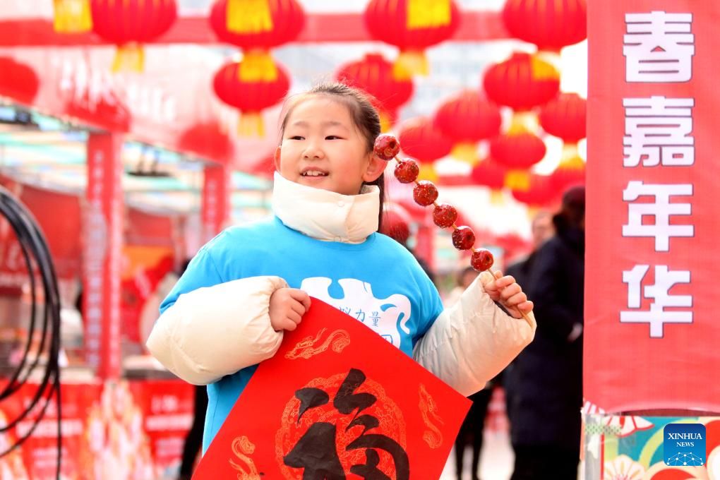 People immerse themselves in traditional customs and partake in festivities before Spring Festival across China