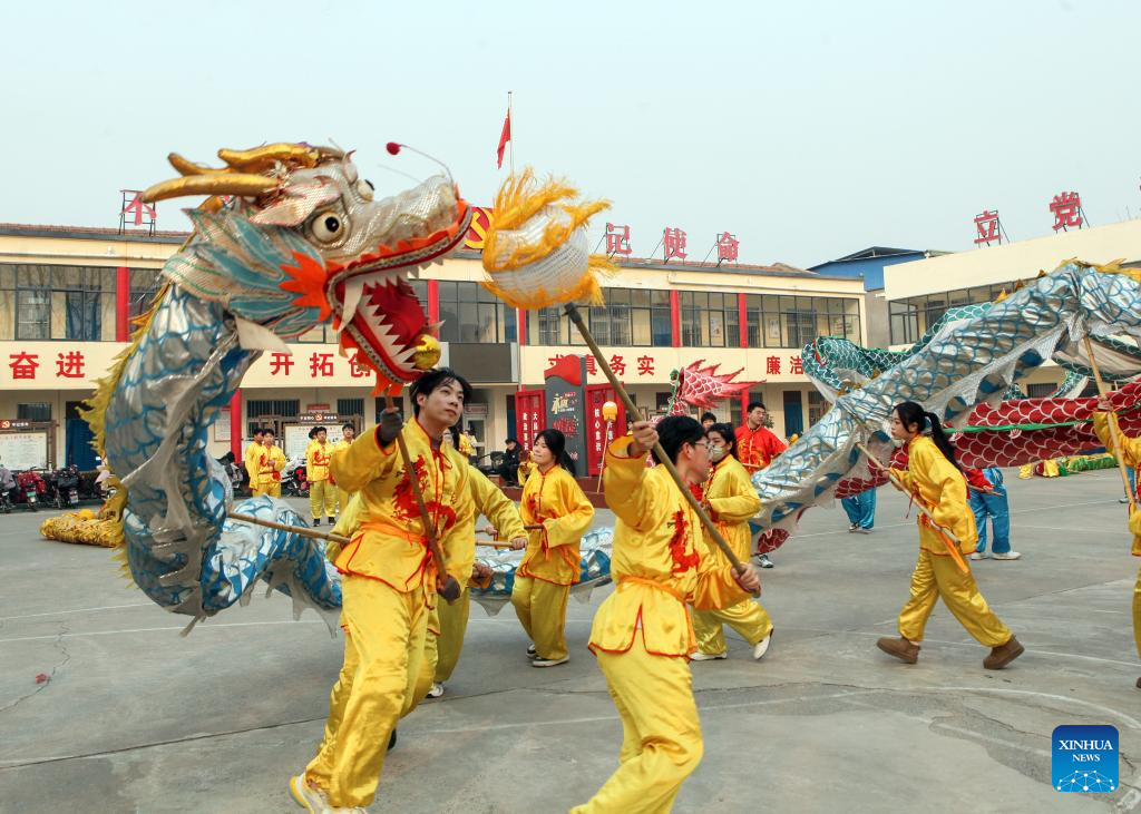 People immerse themselves in traditional customs and partake in festivities before Spring Festival across China