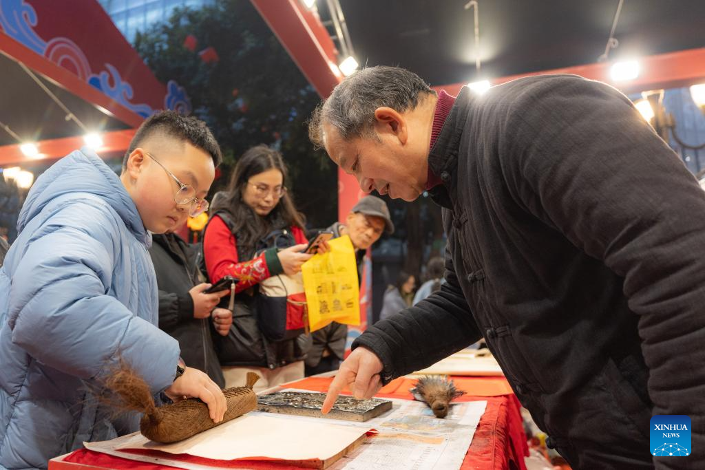 In pics: Inheritor of Liangping New Year Woodblock Prints in SW China's Chongqing