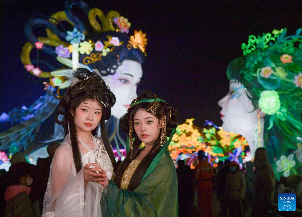 Tourists visit 31st Zigong Int'l Dinosaur Lantern Show in Zigong, China's Sichuan