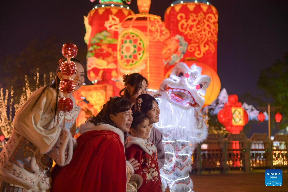 Tourists visit 31st Zigong Int'l Dinosaur Lantern Show in Zigong, China's Sichuan