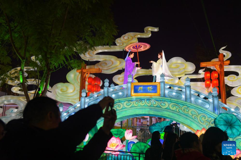 Tourists visit 31st Zigong Int'l Dinosaur Lantern Show in Zigong, China's Sichuan