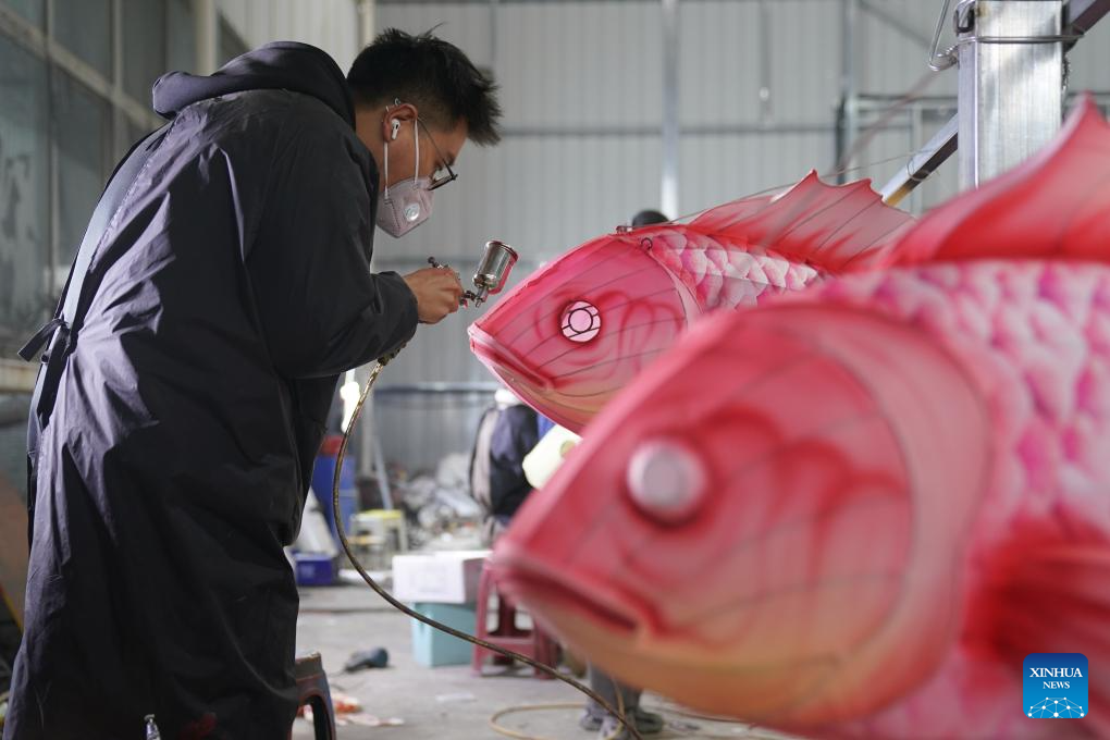 Tourists visit 31st Zigong Int'l Dinosaur Lantern Show in Zigong, China's Sichuan