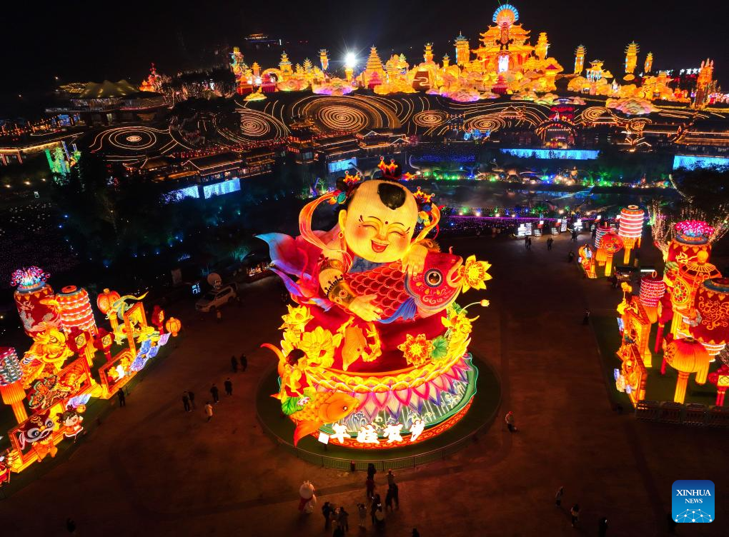 Tourists visit 31st Zigong Int'l Dinosaur Lantern Show in Zigong, China's Sichuan