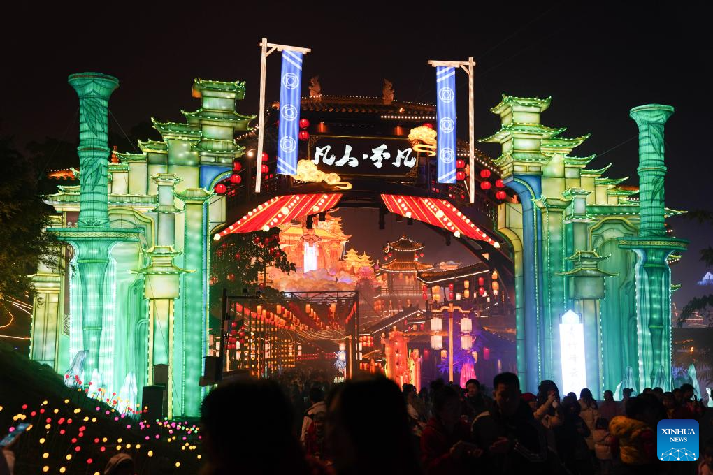 Tourists visit 31st Zigong Int'l Dinosaur Lantern Show in Zigong, China's Sichuan