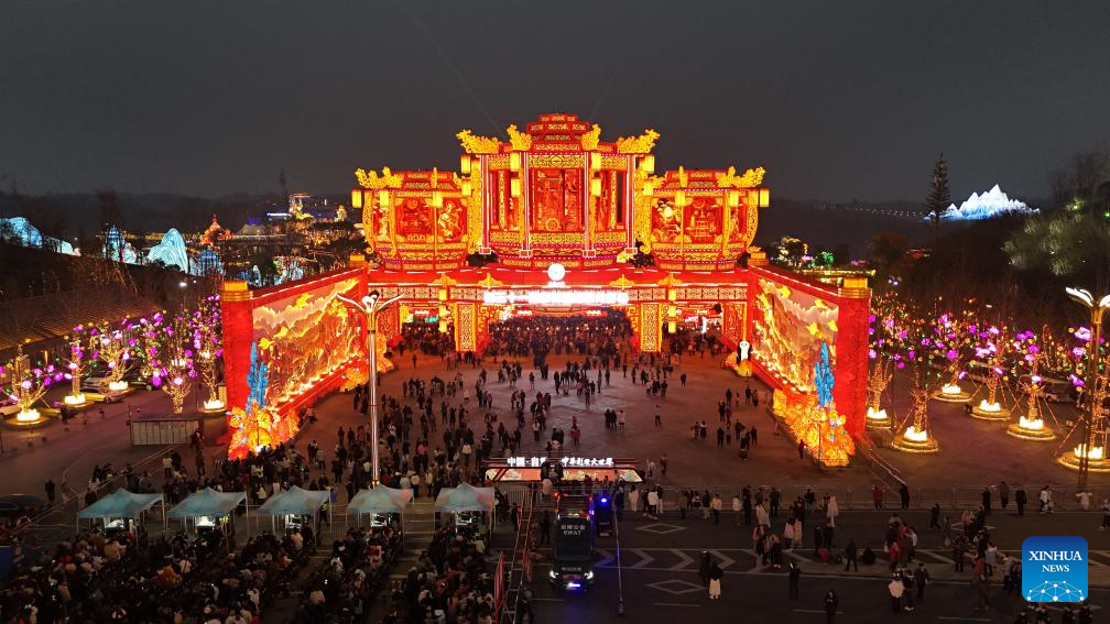 Tourists visit 31st Zigong Int'l Dinosaur Lantern Show in Zigong, China's Sichuan