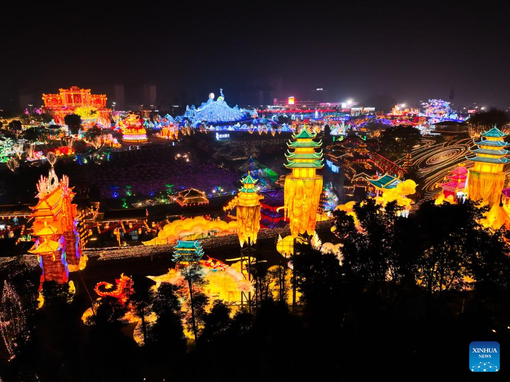 Tourists visit 31st Zigong Int'l Dinosaur Lantern Show in Zigong, China's Sichuan