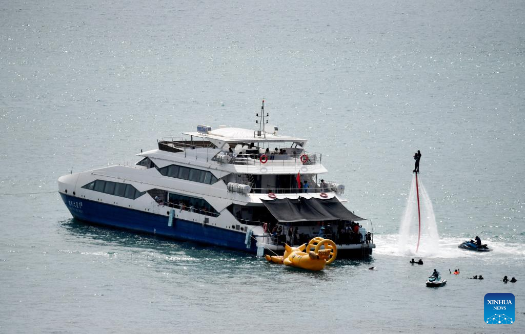 Tourists take yachts to have fun in Sanya, China's Hainan