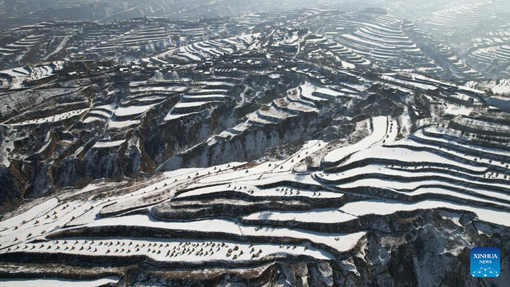 Snow scenery of terraced fields in China's Gansu