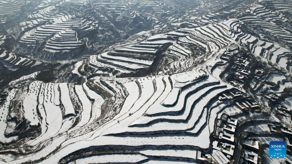 Snow scenery of terraced fields in China's Gansu